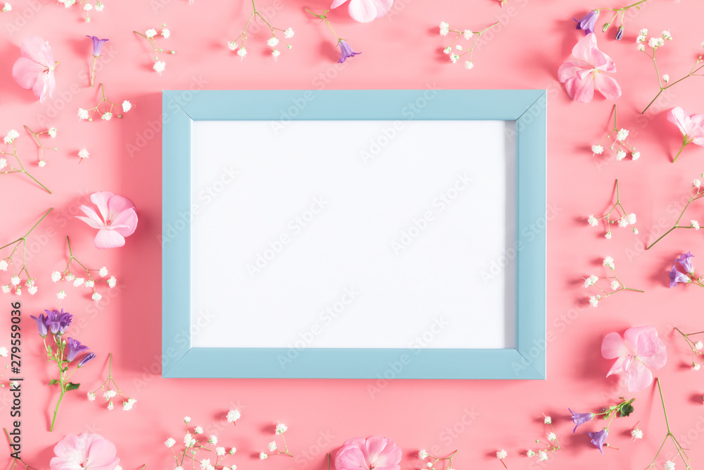 Beautiful flowers composition. Empty photo frame, pink flowers on pastel pink background. Valentines Day, Easter, Birthday, Happy Women's Day, Mother's day. Flat lay, top view, copy space Beautiful flowers composition. Empty photo frame, pink flowers on pastel pink background. Valentines Day, Easter, Birthday, Happy Women's Day, Mother's day. Flat lay, top view, copy space