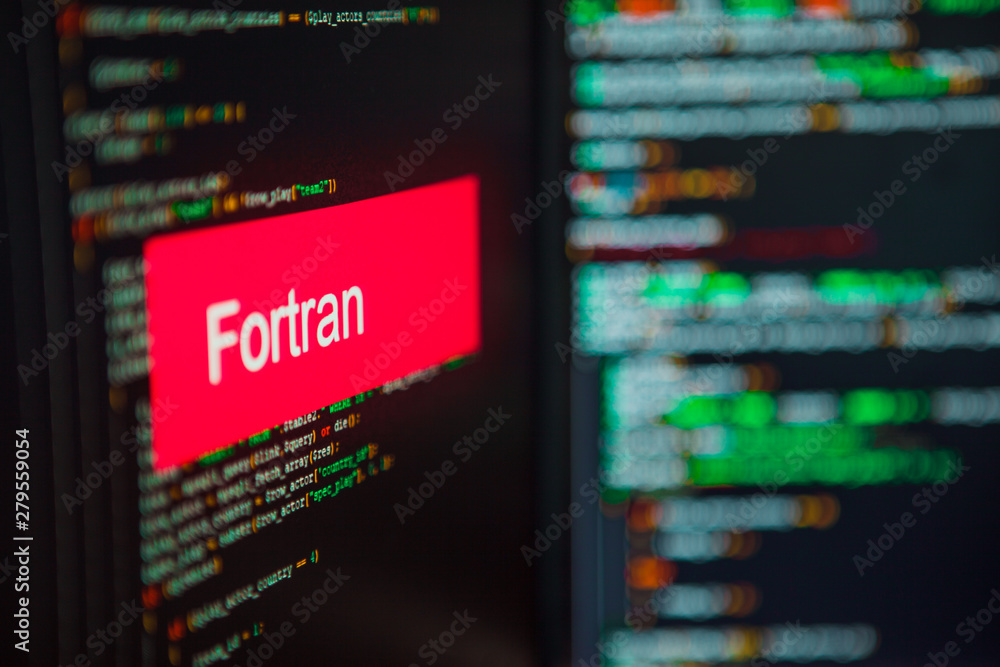 Programming language, FORTRAN inscription on the background of computer code. Programming language, FORTRAN inscription on the background of computer code.