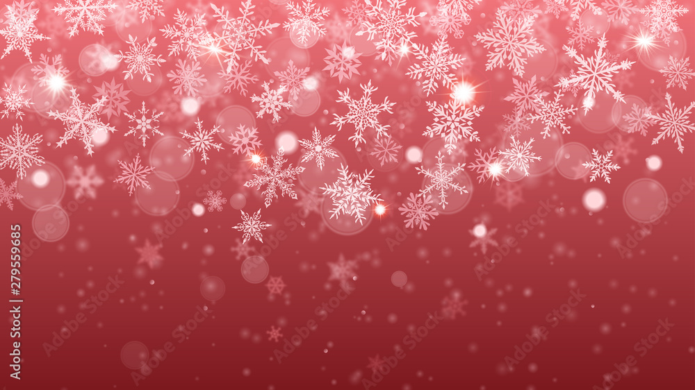 Christmas background of complex blurred and clear falling snowflakes in red colors with bokeh effect