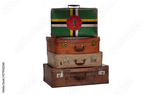 Dominica travel concept. Group of vintage suitcases isolated on white background.
