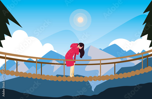 hiking woman crossing bridge mountains landscape