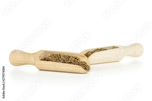 Lot of whole dry caraway fruits in two scoops isolated on white background