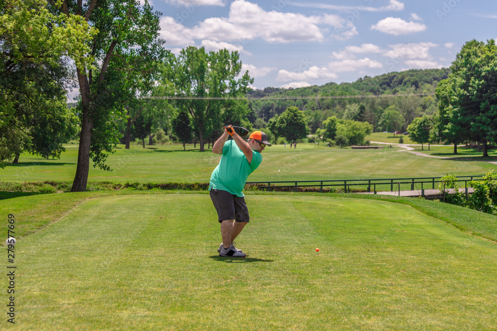 Golfer Driving from Tee Box on Golf Course