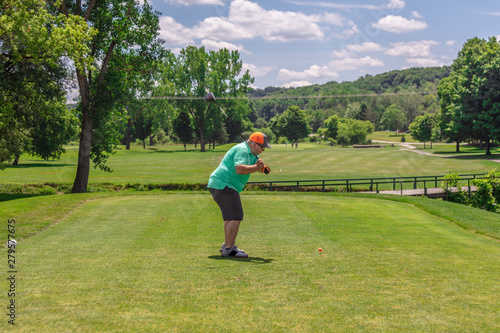 Golfer Driving from Tee Box on Golf Course