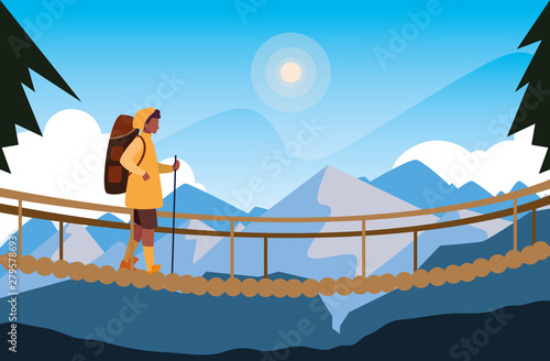 man crossing bridge mountains landscape