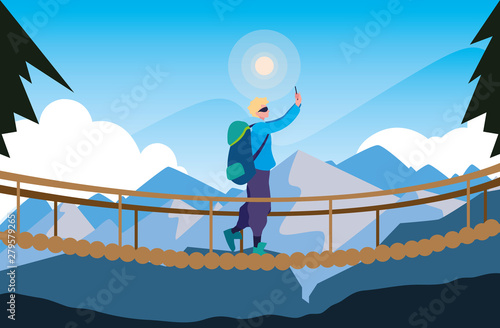 man crossing bridge mountains landscape