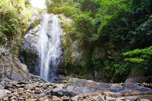 Waterfall in rain forest landscape.