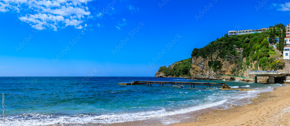 Panorama of Richard s Head beach and turquoise water of the Adriatic Sea by the Old Town in Budva, Montenegro, Balkans