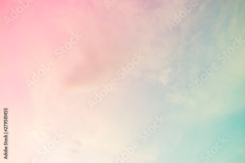 A soft cloud background with a pastel colored orange to blue gradient. photo
