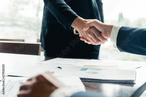 business man shaking hands during a meeting in the office, success, dealing, greeting and partner concept