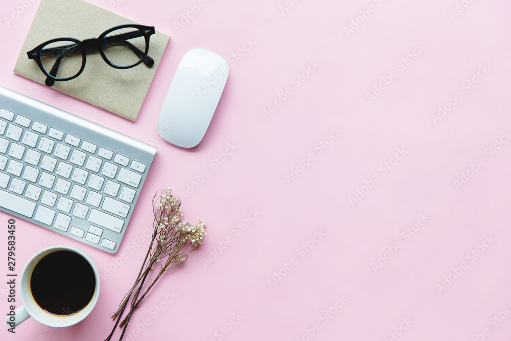 pink background desk table with laptop, cup of coffee and supplies. pink background desk table with laptop, cup of coffee and supplies.