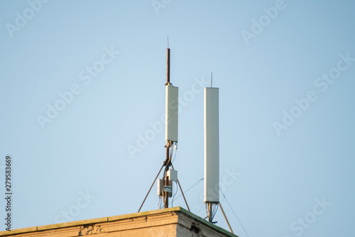 5g modern tv and smartphone telecommunication station antenna against the sky in the city