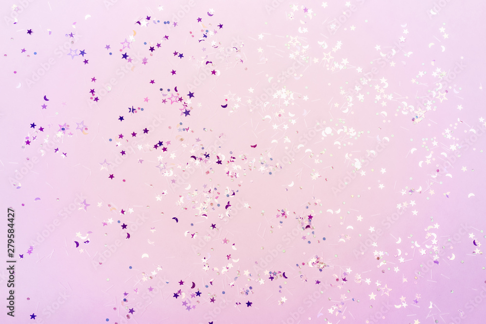 Holographic glitter confetti in pastel neon lights. Festive trendy background
