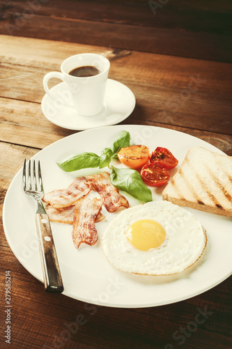 Fried eggs with bacon on breakfast