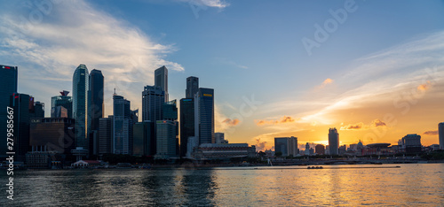 The Central Business District and Marina Bay skyline at dusk in Singapore