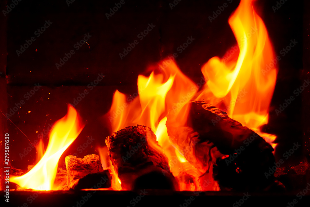Wallpaper with a bright fire inside the brazier. Flame of fire. Preparation for cooking barbecue, kebabs. Hot coal with lights. Wallpaper with a bright fire inside the brazier. Flame of fire. Preparation for cooking barbecue, kebabs. Hot coal with lights.