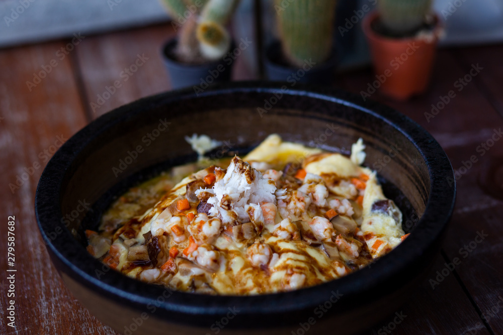 Creamy omelet with seafood on rice Creamy omelet with seafood on rice