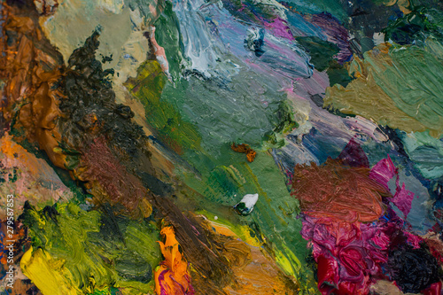 Close up palette with oil paints. Abstract background. © Smile