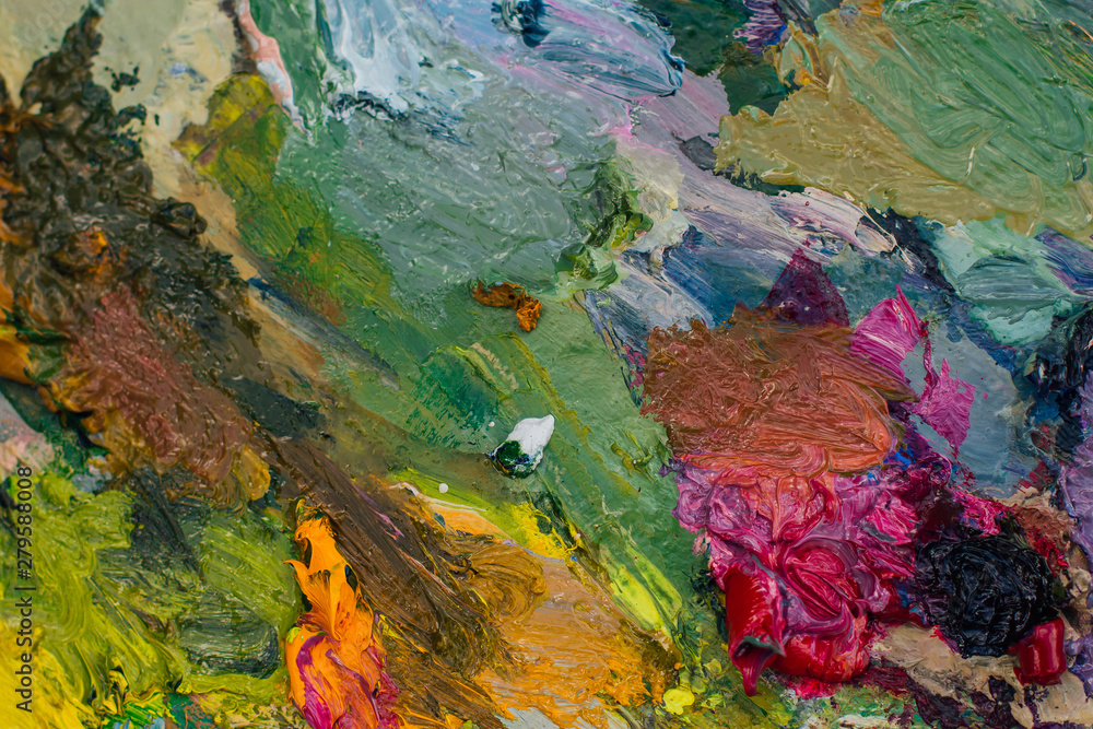 Close up palette with oil paints. Abstract background. Close up palette with oil paints. Abstract background.