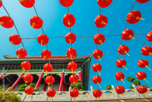 Red pgoda of chinese style temple in Bangkok photo