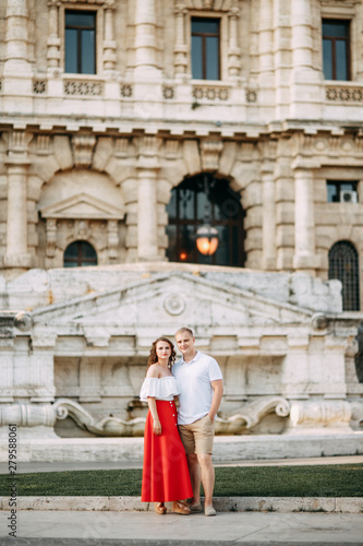 Stylish loving couple walking and laughing. Wedding shooting on the streets of Rome, Italy. © pavelvozmischev