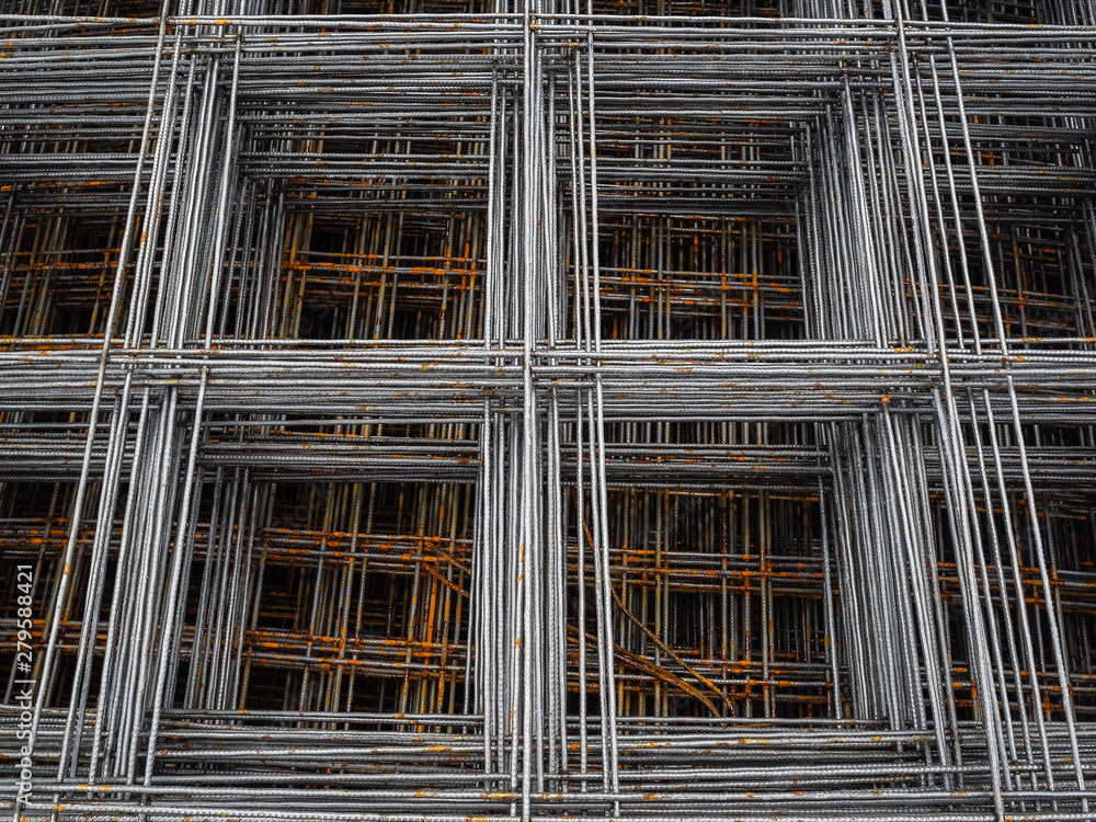 Metal mesh for concrete reinforcement. Rusty bars of metal for use in construction