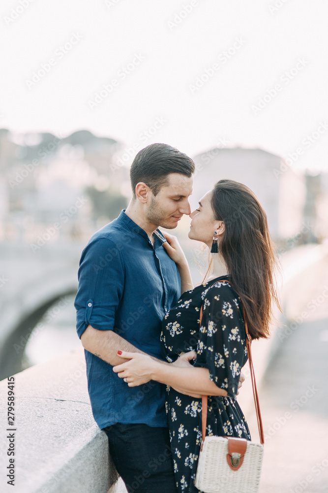 Fototapeta premium Wedding photography in Italy. Couple walking the streets of Rome, sightseeing and panoramic views.
