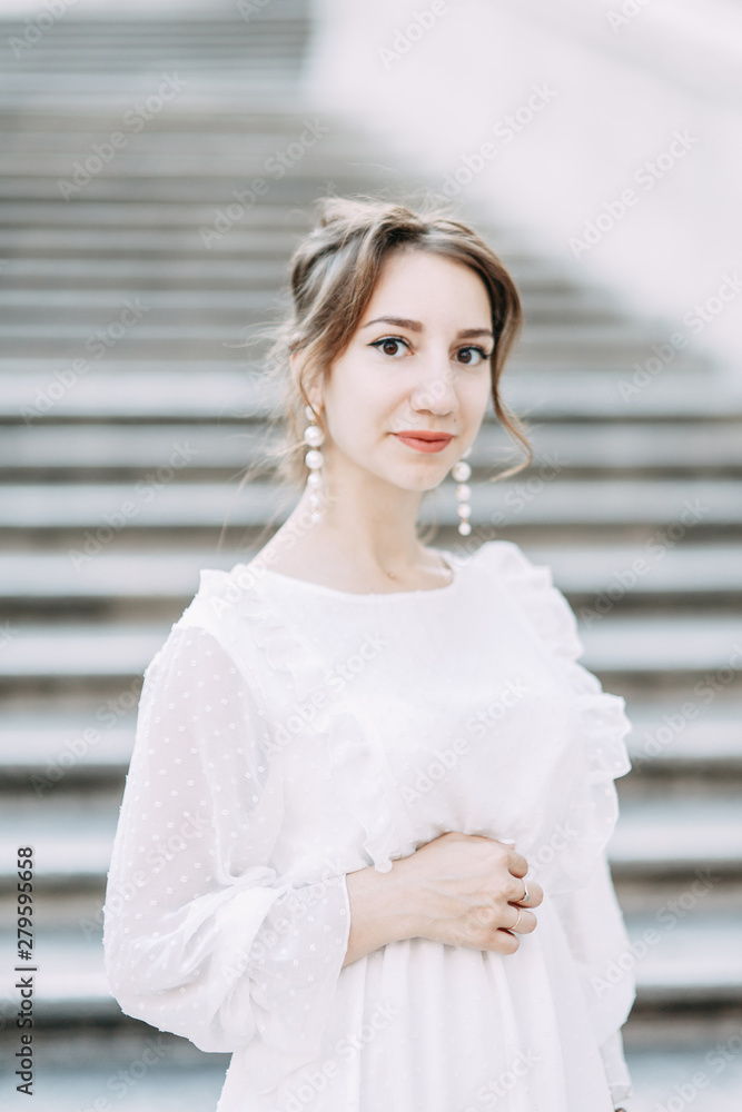 Fototapeta premium Wedding photo shoot of the bride in Italy. Portrait of a stylish girl on the streets of Rome.