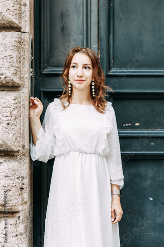 Wedding photo shoot of the bride in Italy. Portrait of a stylish girl on the streets of Rome.