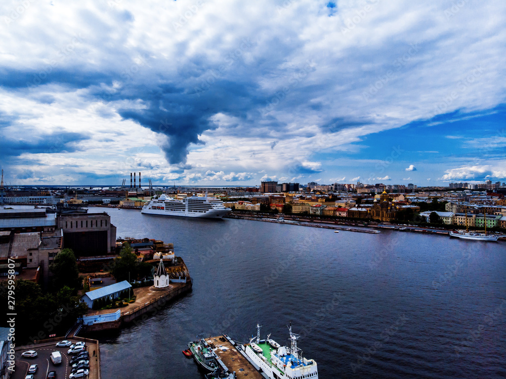 Naklejka premium Panorama of the city, river and ship, view from quadrocopter drone flight