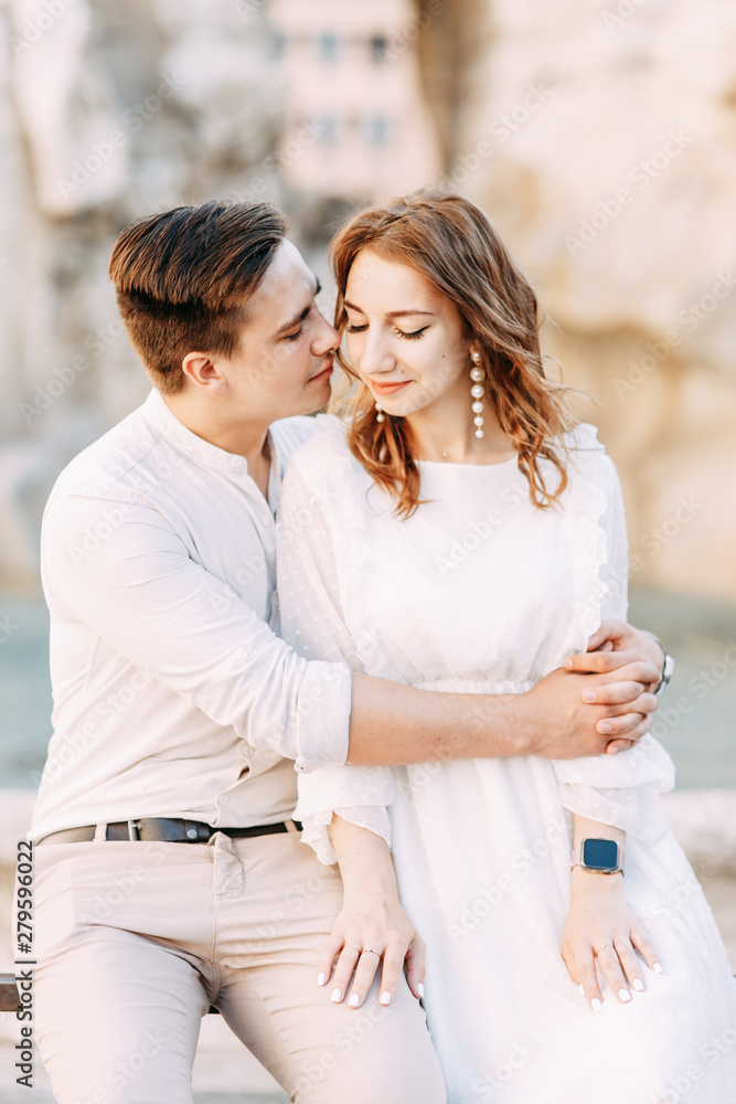 Fototapeta premium Beautiful stylish pair of in the European style. Wedding photo shoot on the streets of Rome.