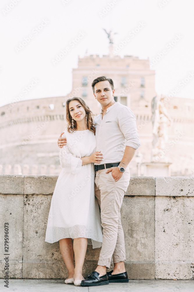 Fototapeta premium Beautiful stylish pair of in the European style. Wedding photo shoot on the streets of Rome.