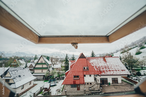 View into the window wooden roofs of houses in Zakopane. Poland