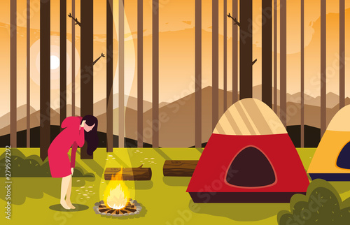 woman camping campfire forest tent