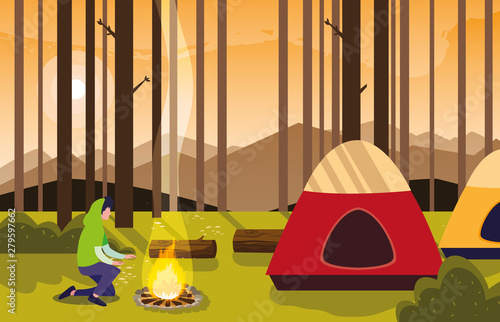 man camping campfire forest tent