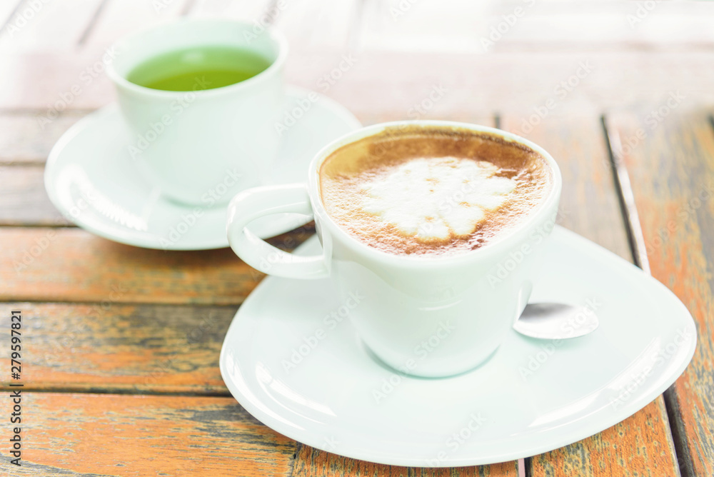 hot coffee on table / hot cappuccino with nice pattern milk foam hot coffee on table / hot cappuccino with nice pattern milk foam