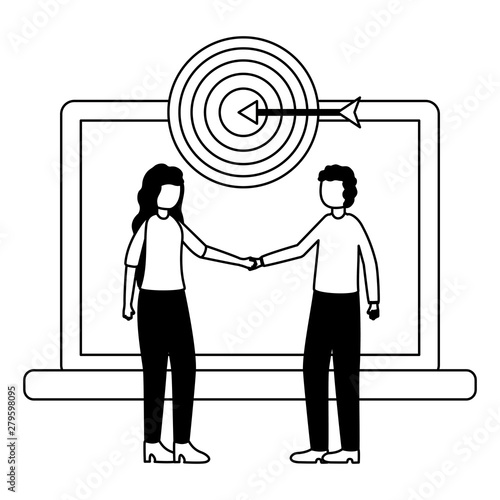 young business couple team with laptop and target