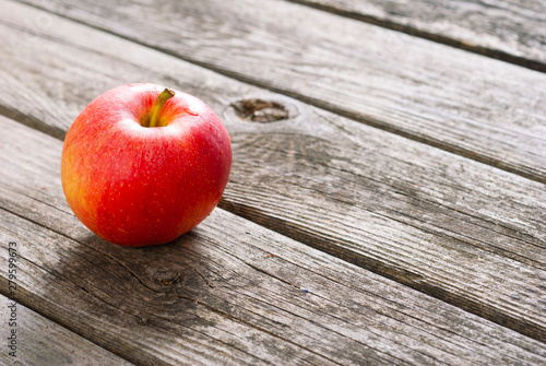 apple on old wood table photo