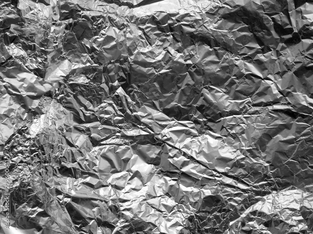 Texture of old crumpled aluminium food foil background Texture of old crumpled aluminium food foil background