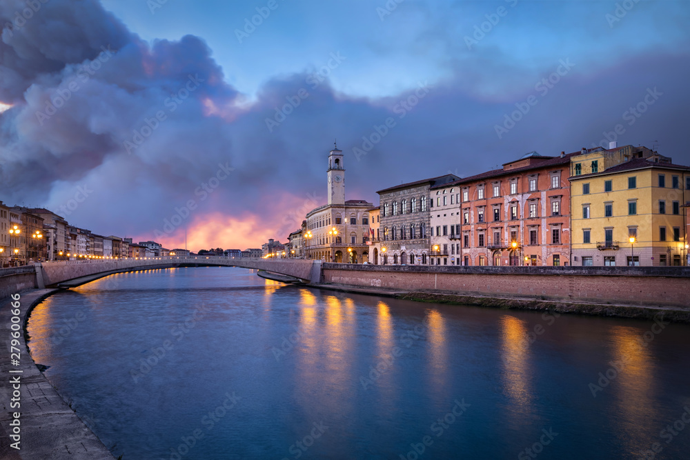 Arno river and Ponte di Mezzo bridge in Pisa, Italy