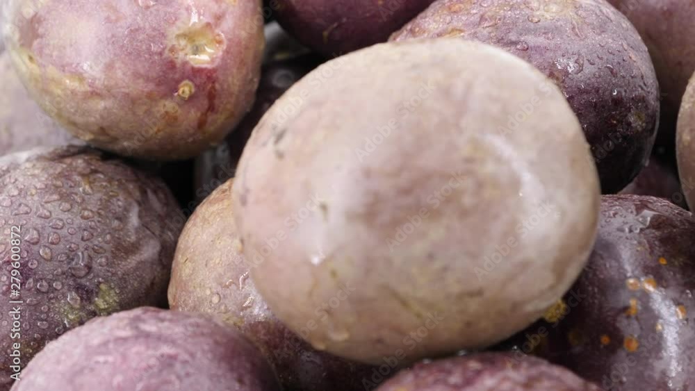 Food background, ripe passion fruits rotating (loopable). Shot in 4K Food background, ripe passion fruits rotating (loopable). Shot in 4K