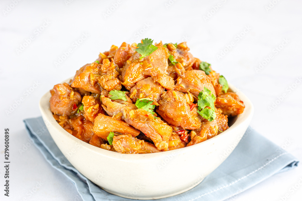 Chinese Style Stir-Fried Chicken in a White Bowl on White Background. Chinese Style Stir-Fried Chicken in a White Bowl on White Background.