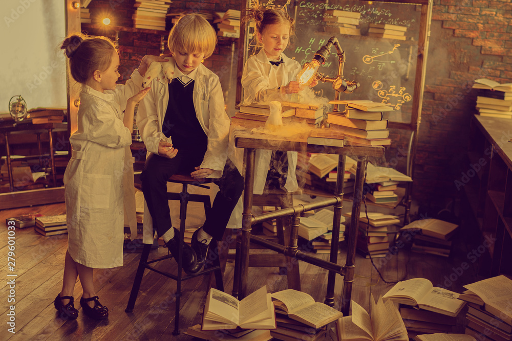 schoolchildren in chemistry laboratory making experiment