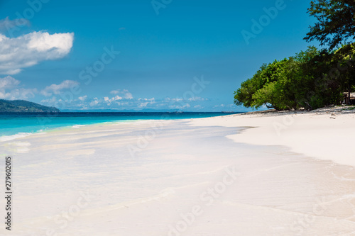 Paradise beach with blue ocean in tropical island
