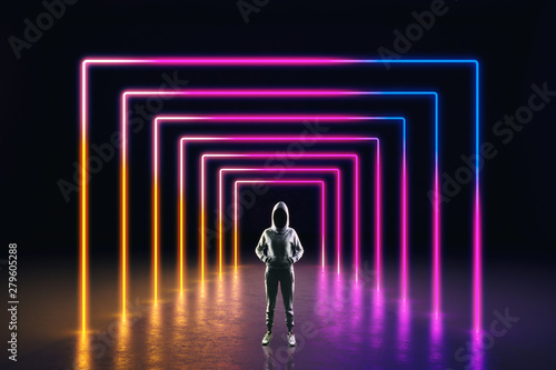 Hacker in neon hallway