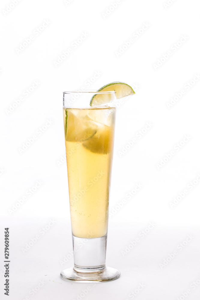 Lemonade with lime slice in tall glass isolated on white background