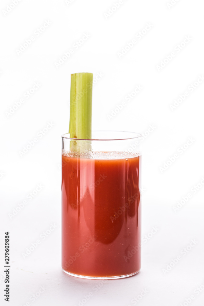 Bloody Mary alcoholic cocktail in glass garnished with celery isolated on white background Bloody Mary alcoholic cocktail in glass garnished with celery isolated on white background