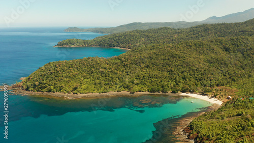 Fotografering Aerial view beautiful tropical beach in the cove with blue lagoon and turquoise water surrounded by rainforest