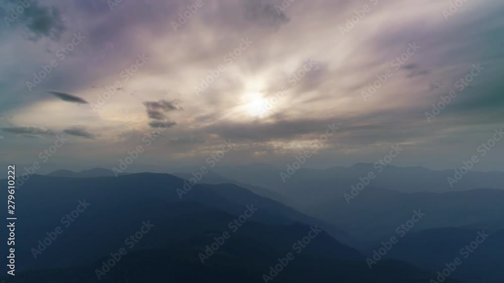 The flight above a foggy mountain on a sunset background. Hyperlapse The flight above a foggy mountain on a sunset background. Hyperlapse