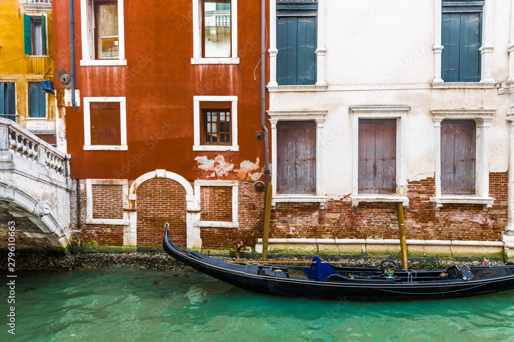 Gondola in a small Venetian canal Gondola in a small Venetian canal